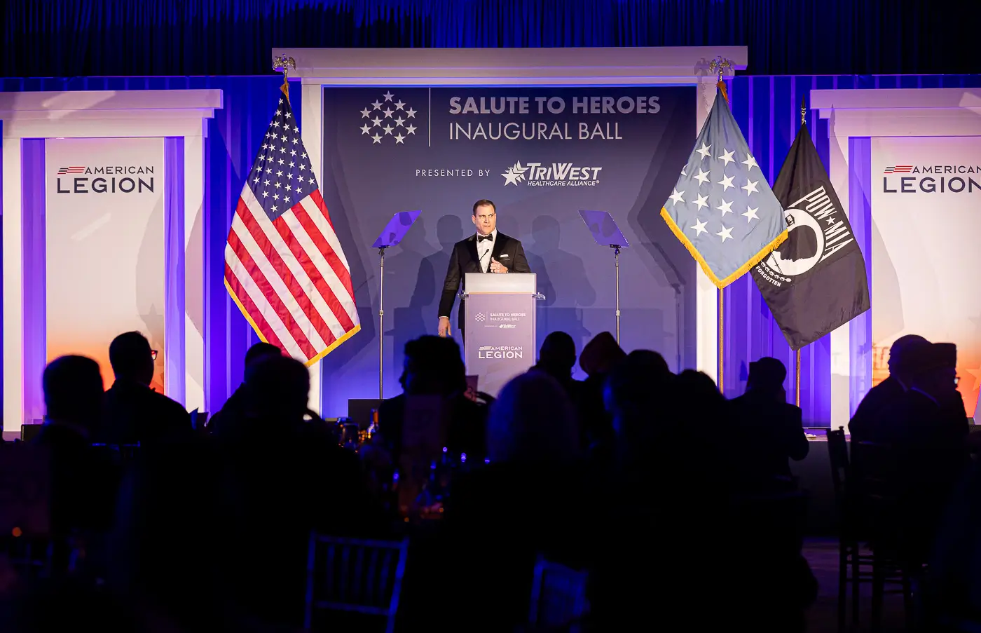 A speaker addresses guests at an inaugural ball in Washington, DC